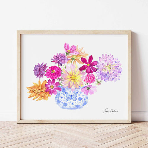 Blue and White vase filled with bright dahlia flowers of different varieties. Colors used: purple, lilac, magenta, pink, yellow, royal blue, light blue, orange