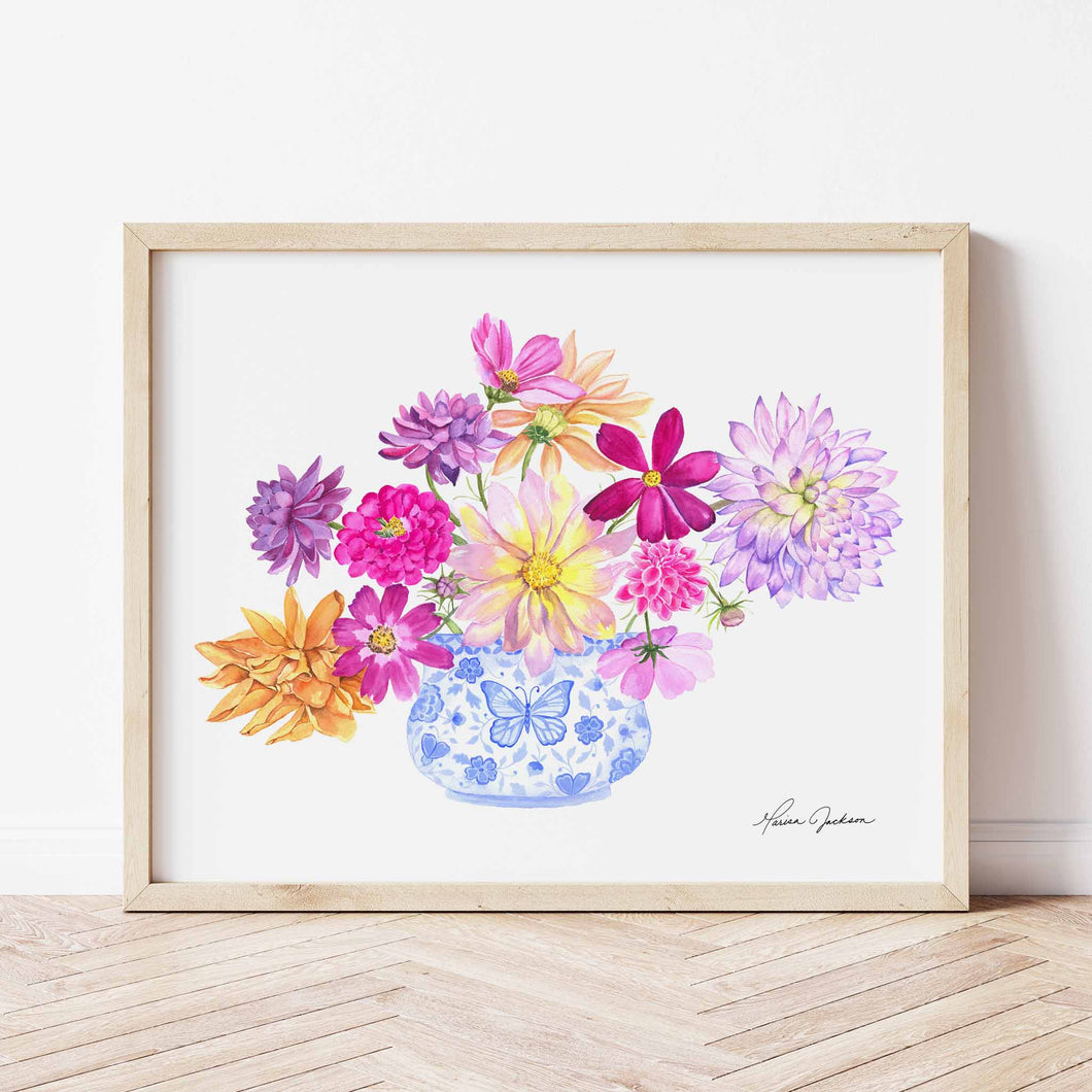 Blue and White vase filled with bright dahlia flowers of different varieties. Colors used: purple, lilac, magenta, pink, yellow, royal blue, light blue, orange