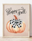 Happy Fall Art Print with a painted burnt orange pumpkin topped with a buffalo plaid bow. "Happy Fall" is handlettered above the pumpkin artwork.